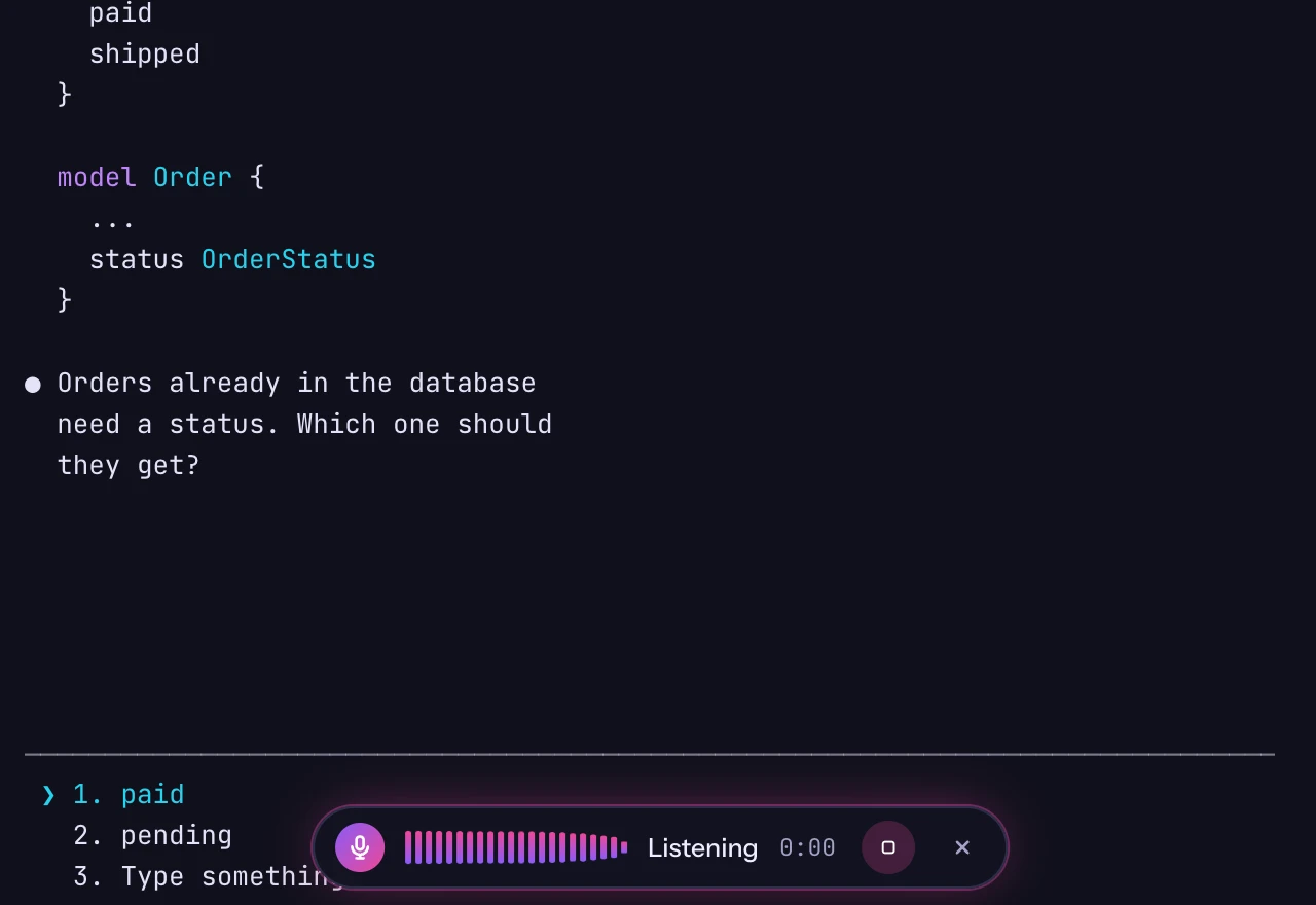 The dictation pill listening while Claude waits for an answer